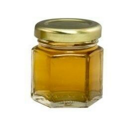 [A0290] 2.25 OZ OF WILD-FLOWER RAW HONEY IN A HEXAGONAL GLASS JAR 